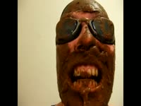 Man on glasses eats shit